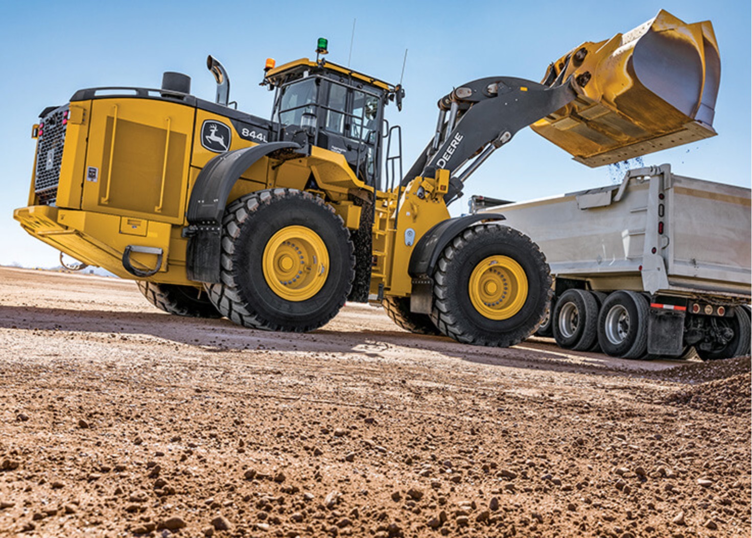 Loader filling a dump truck